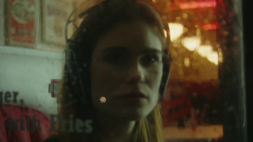 A portrait of a woman in a restaurant
