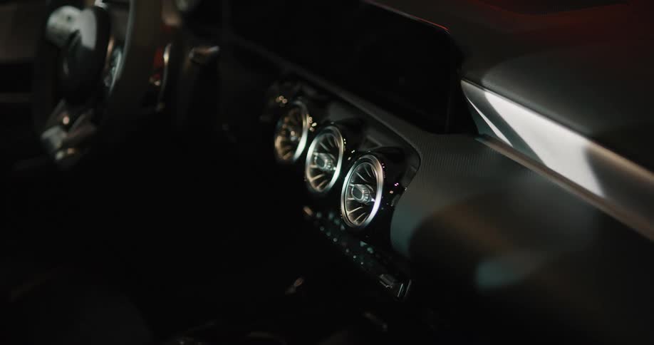 Inside a vehicle is displayed at night