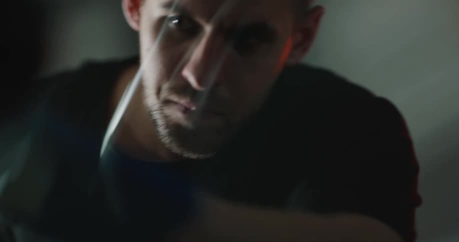 A man cleans glass with a cloth