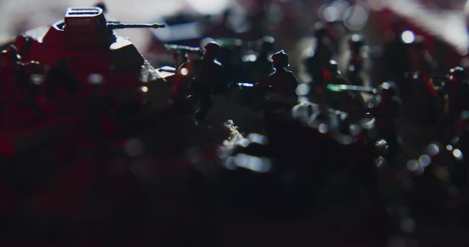 Light moves over a collection of military toys