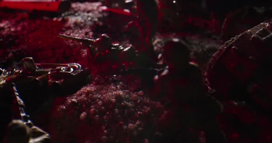 Light flashes near a collection of military toys sitting in the dirt