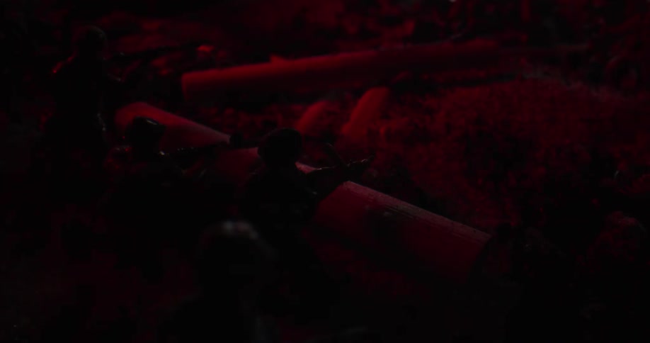 Light flashes near a collection of military toys