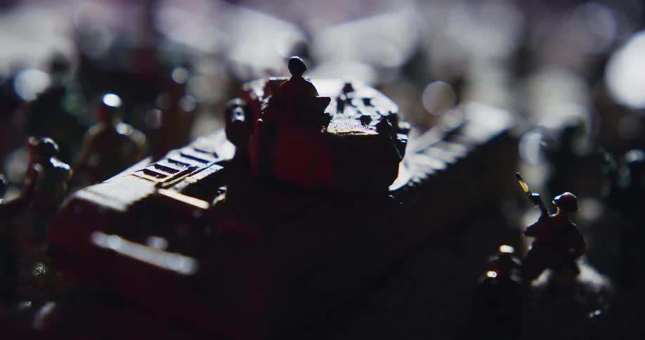 Toy army men with a toy tank