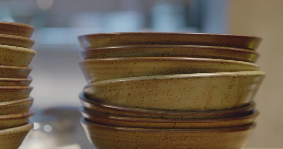 Stoneware bowls stacked in a kitchen