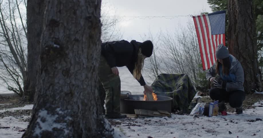 Two women make camp in the winter
