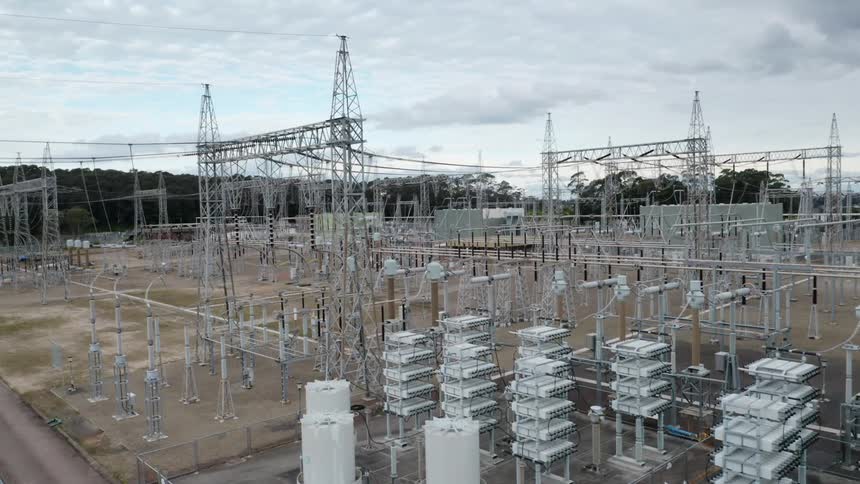 Aerial view of an electrical substation at sunset
