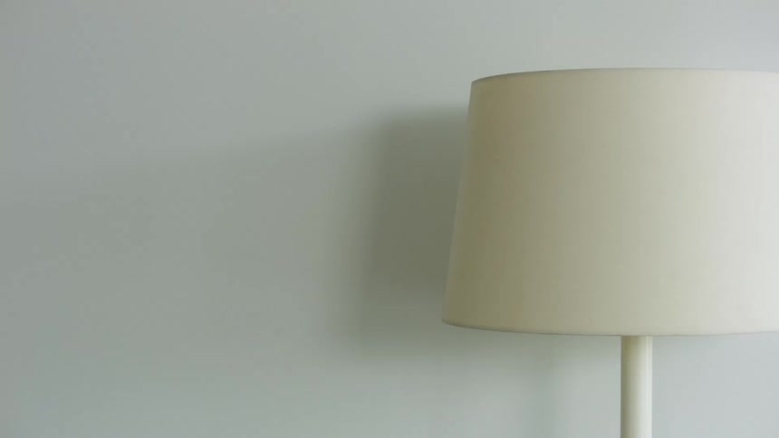 White of lamps shade and body contrasts with light blue of walls