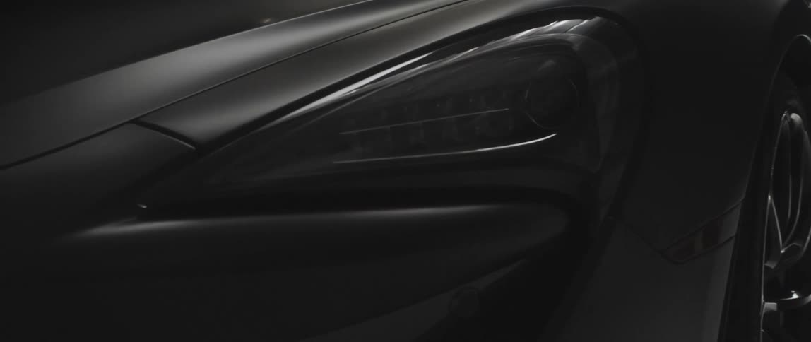 The front edge of a black sportscar