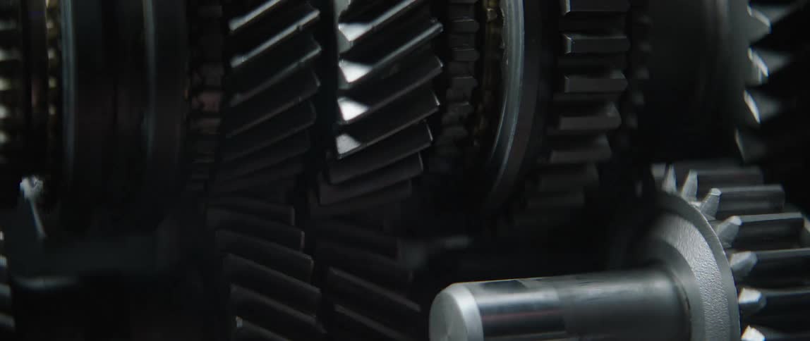 Automotive engine gears mesh and rotate