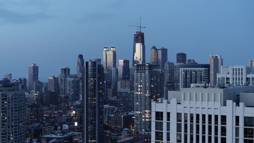 Skyscrapers in Chicago  while cars travel on the city street