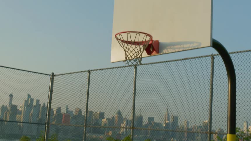 A basketball being shot into a hoop