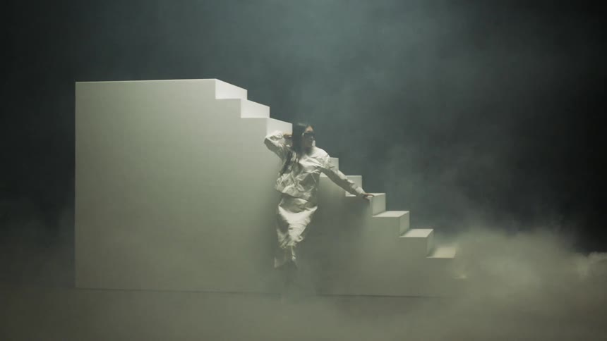 A woman that is dancing on a stage