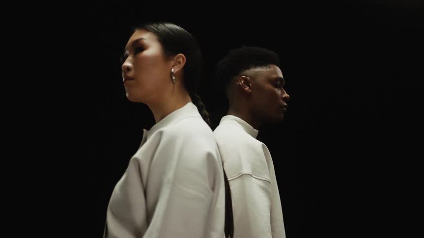 A man and a woman are standing next to eachother