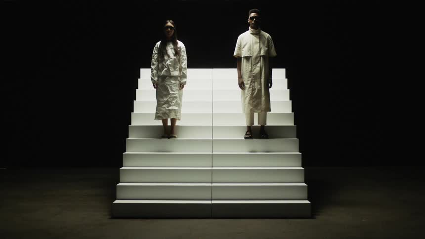 Man and woman are standing on a staircase