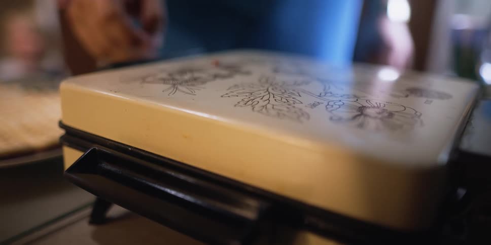 People are cooking waffles for breakfast in their house