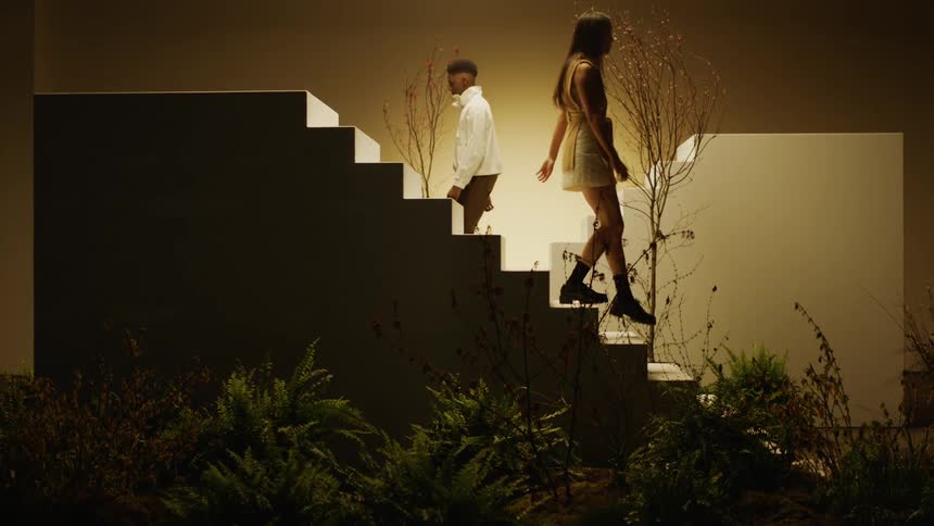 Young people walking down the stairs on a stage