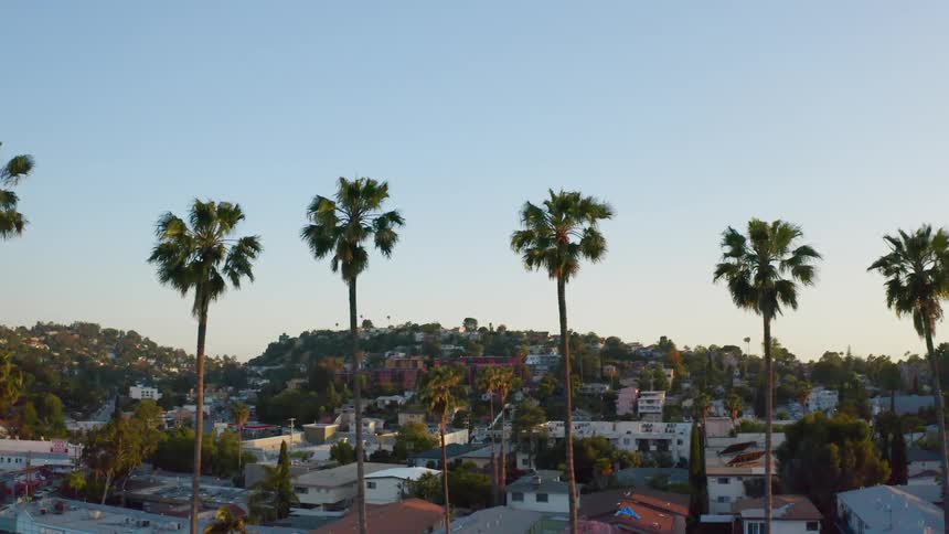 Aerial view of a city is displayed at sunset