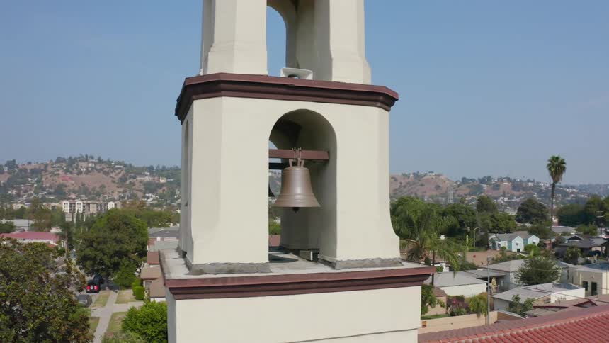 Aerial view of a church is displayed in a city