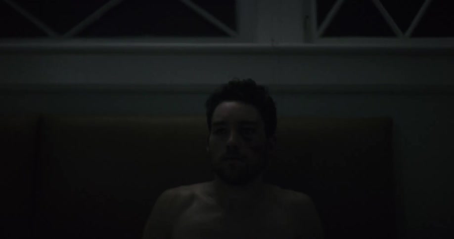 A man pops up in bed very suddenly
