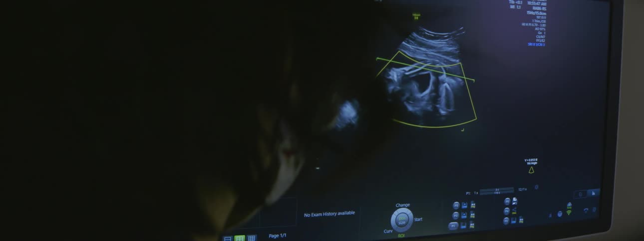 A man looks at a screen displaying a radar
