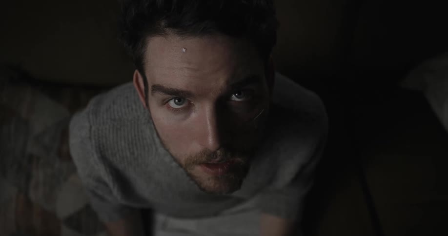 A close up of a man who is somewhat out of it