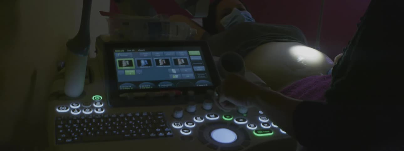 A machine is lit up with many buttons