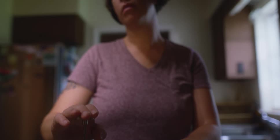Woma brewing coffee over the kitchen counter top at home