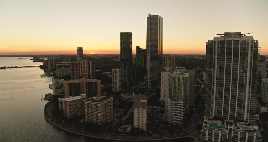 Aerial view of an urban city is displayed at dusk