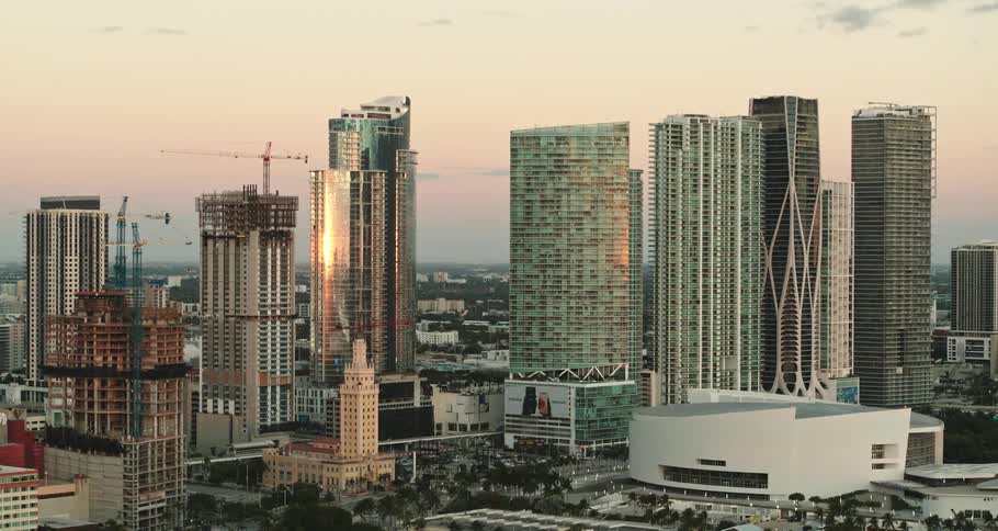 Buildings are under construction in a city full of smog