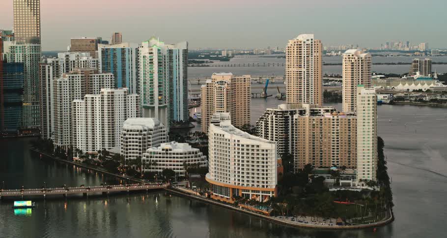 Aerial display of a city is displayed near the ocean