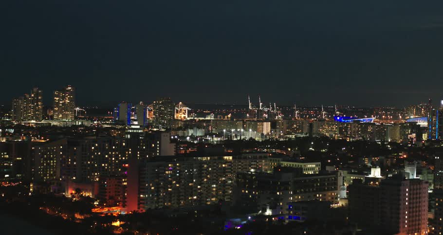 Aerial view of illuminated city buildings at night