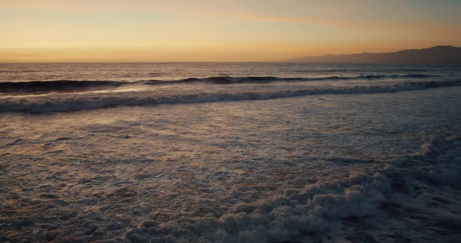 A wide shot of a beach ocean