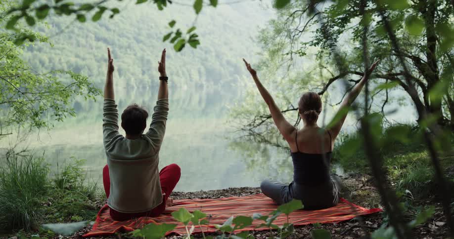 Woman and man doing yoga