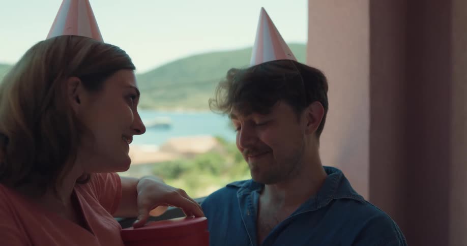 A wife giving a present to her husband