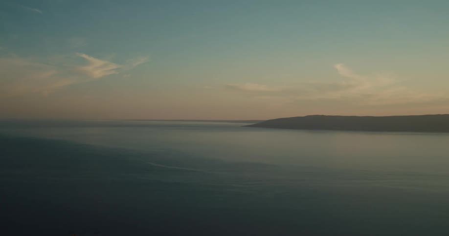 Coastal ocean view with a few clouds in the sky