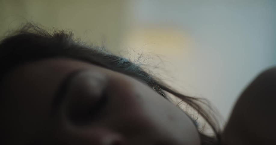 Woman with dark hair has a nap