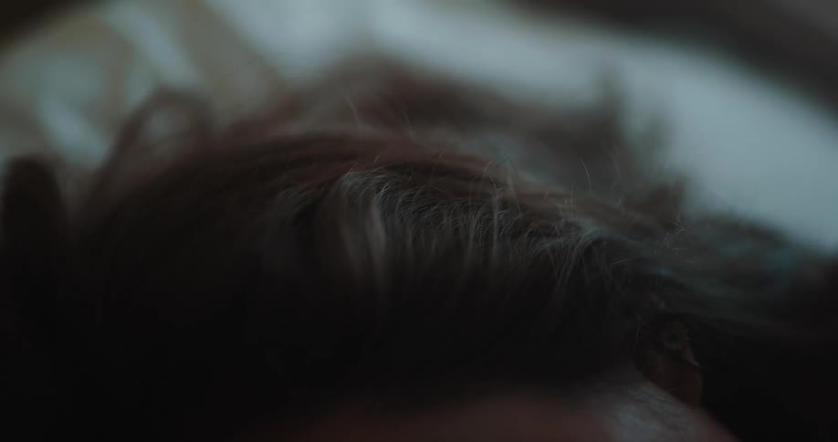 A woman sleeping in a bed