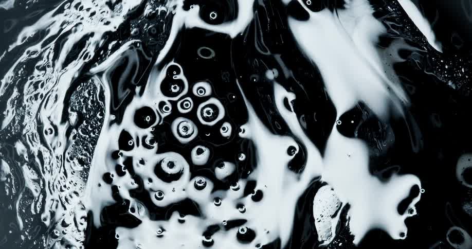 Black reflective pulsing liquid ink bubbling and pulsing