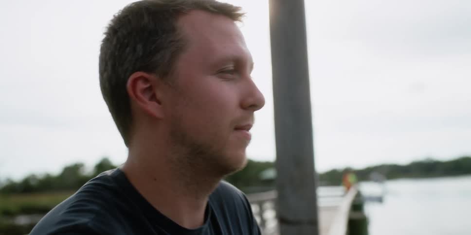 A close up of a man on a pier