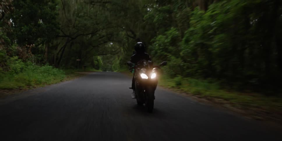 A person riding a motorcycle outdoors