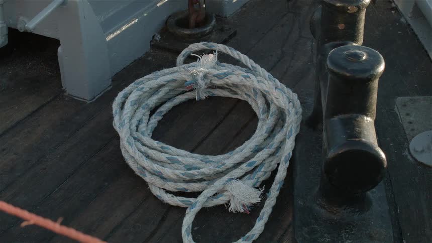 Rope sits on the deck of a boat