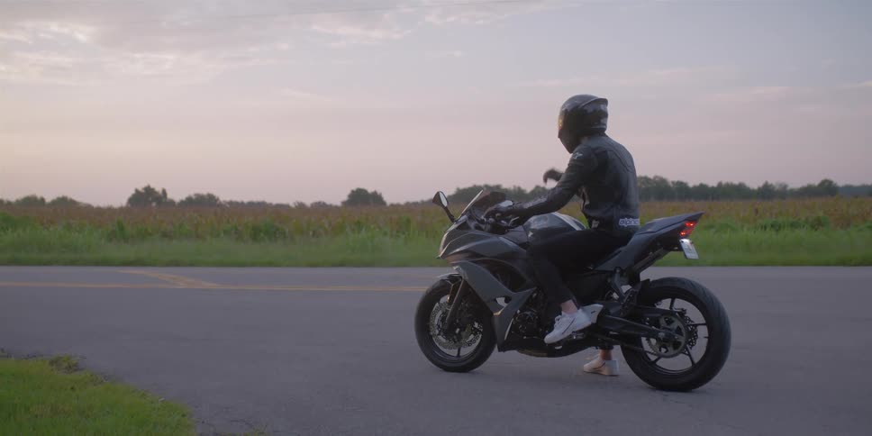 A person makes a turn on the motorcycle