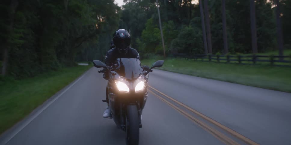 A person that is riding a motorcycle outdoors