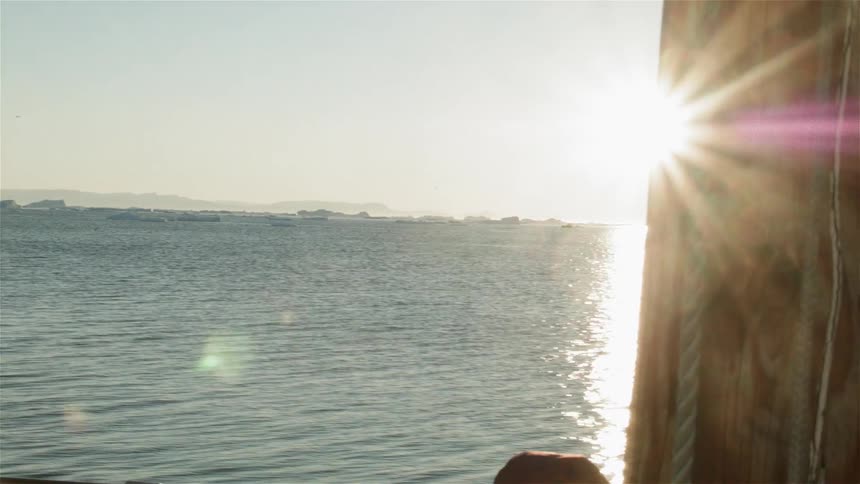 View out of a boat of the water on a sunny day