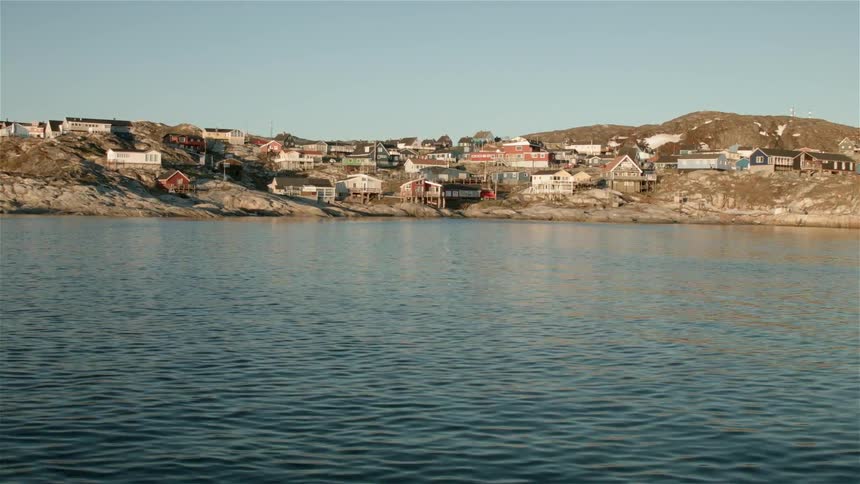 A town at the edge of a large body of water