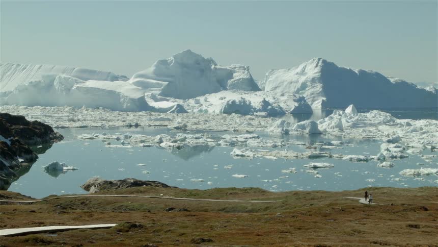 The water near this field is full of ice