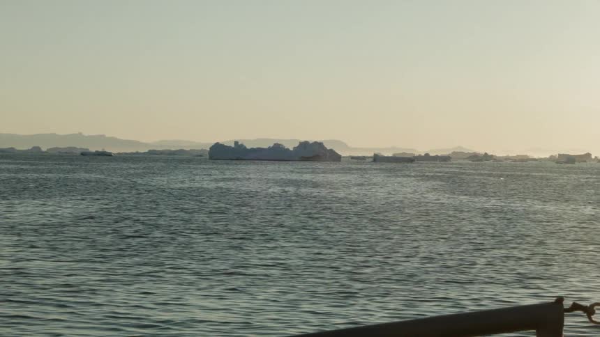 Sailing past chunks of ice during the day