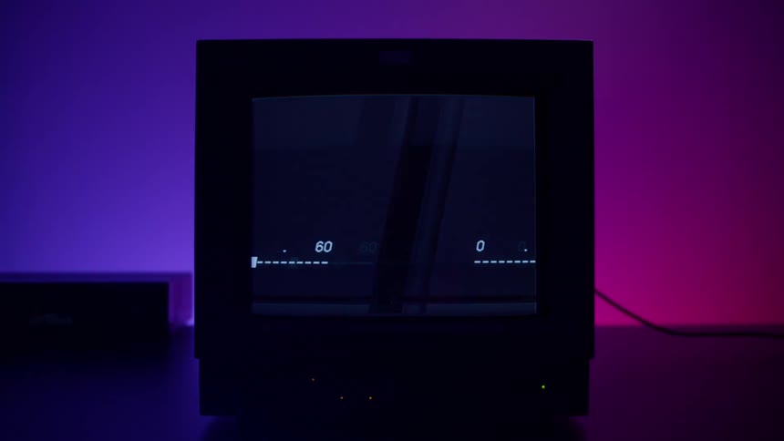 The television is flickering in the dark room