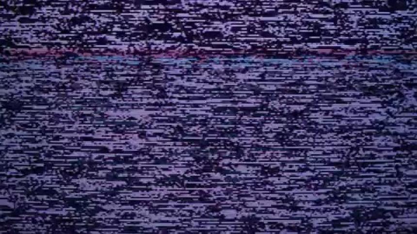 The television screen flickers with static