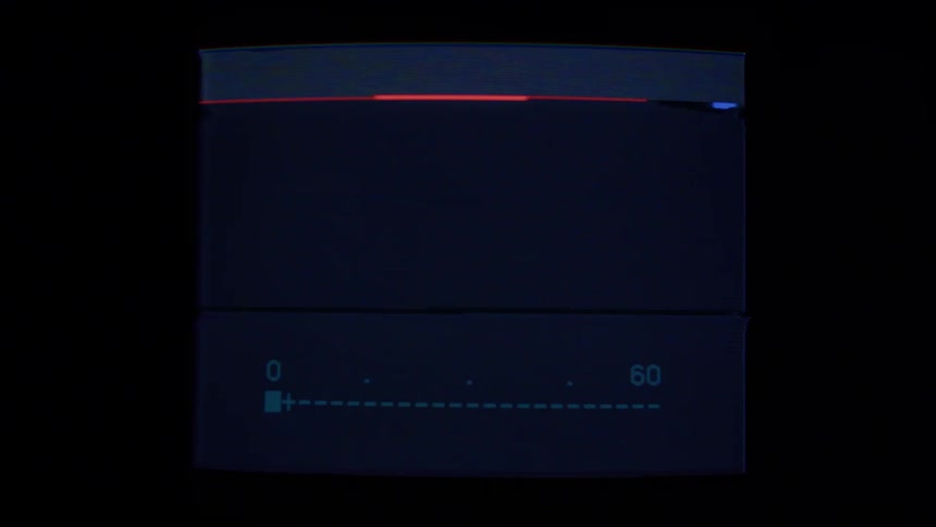 A television screen is displayed in a room and is flashing
